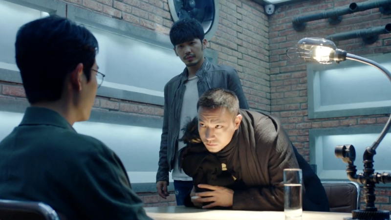 Screencap of Chu Shuzhi, Zhao Yunlan, and Shen Wei from Guardian Chu Shuzhi leans over the table toward Shen Wei with Zhao Yunlan standing behind him.